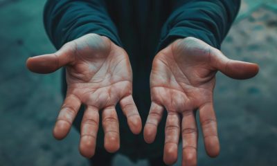 human hands opened up towards camera