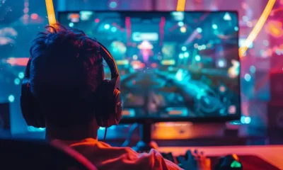 teen playing a game on pc