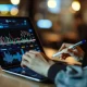 person analyzing stocks on tablet