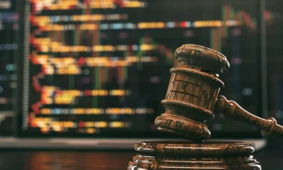 judge gavel in front of screen
