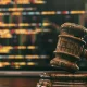 judge gavel in front of screen