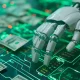 robot hand with dollar bills