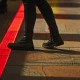 person stepping on a red line