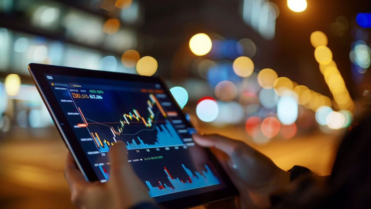 person trading stocks on tablet
